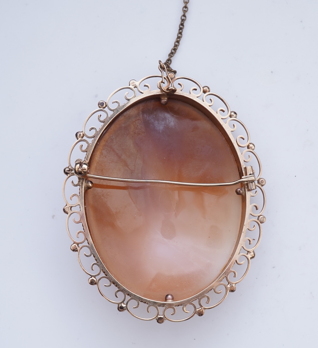A shell cameo brooch and a gold and cultured pearl brooch